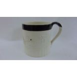 An early 19th century earthenware mug of half gallon capacity by T & J Hollins with applied detail