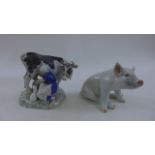 A Copenhagen figure of a seated sow, number 414 and a further Copenhagen figure of a milk maid and