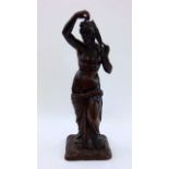 A 19th century carved oak figure, classical female plaiting her hair, 48 cm high