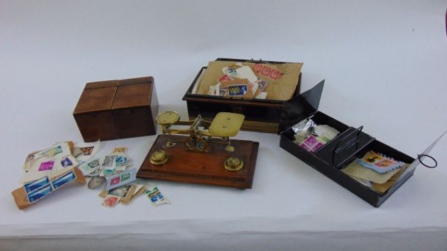 A set of small Victorian brass balance scales raised on an oak base, two sectional mahogany tea