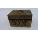 An Eastern hardwood casket overlaid with brass panels, escutcheon and handle, 20 cm maximum