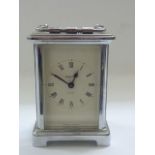 A traditional carriage clock with chromed case by Bayard with 8 day movement