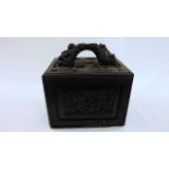 A 19th century Chinese carved cabinet, the fall front enclosing five frieze drawers containing a