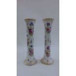 A pair of Dresden trumpet shaped vases with hand painted floral bouquets within gilt reserves, 40 cm