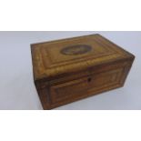 An early 19th century Napoleonic marquetry straw work box, the lid 25 cm maximum