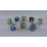 A collection of eight 19th century and later mugs including children's examples, including a deaf