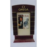 An Omega advertising board - double sided in simulated brickwork, 60 cm tall