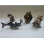 Four pieces of small Copenhagenware comprising a red squirrel number 982, two fishes 287, an otter