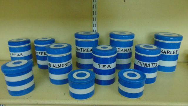A collection of T G Green Cornish blue and white banded ware storage jars, all straight sided