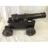 A 19th C Cast Iron Signal Cannon On Wood Carriage. The Cannon Has A 3.5 Cm Bore And Sits On Top Of A
