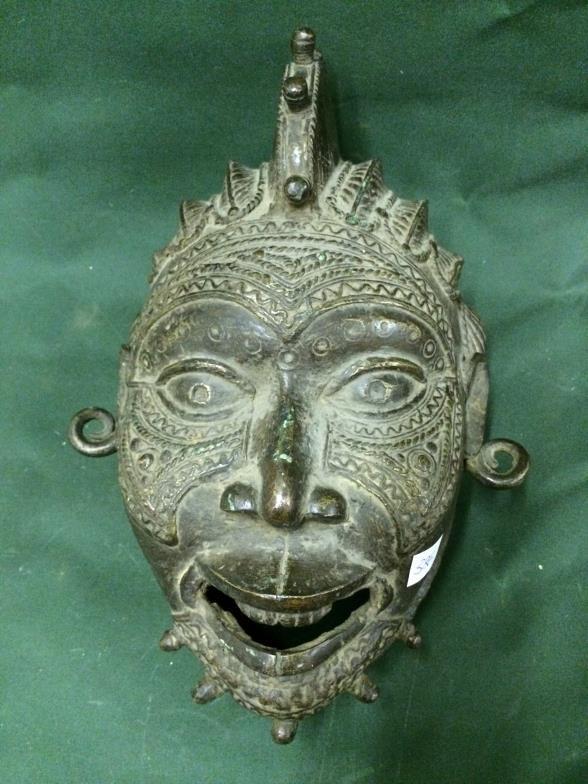 Bronze Tribal Mask From Tikar, measures 36cm x 26cm To bid live please visit www.