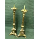 Two Brass Candlestick Holders, One Measures 159 cm and the other 157 cm tall To bid live please