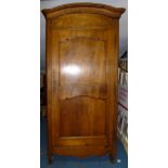 A FRENCH WALNUT WARDROBE WITH A DOUBLE PANELLED DOOR, FLORAL INLAID CORNICE AND ARCHED TOP, c19th (