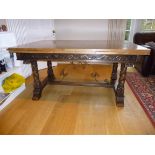 SPANISH WALNUT DINING TABLE WITH A FIGURED DRAW LEAF TOP, CARVED SCROLLING FLORAL FRIEZE ON SPIRAL