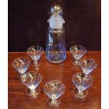 AN ART DECO GLASS COCKTAIL SET COMPRISING A SHAKER WITH STOPPER AND SEVEN GLASSES EACH PAINTED