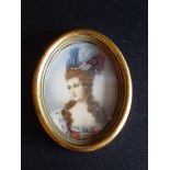 A MINIATURE PORTRAIT OF A WOMAN, SIGNED 'LADE', OVAL (8 cm x 6 cm)