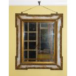 WALL MIRROR WITH BEVELLED UPRIGHT PLATE IN AN ITALIAN GILT MOULDED FRAME WITH MARBLED GLASS