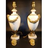 A PAIR OF FRENCH ALABASTER TABLELAMPS, EACH WITH GILT BRONZE FLORAL SWAGS AND MASK MOUNTS, ON A