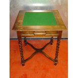 GEORGE V OAK CARD TABLE WITH A FLIP OVER SQUARE TOP AND A DRAWER ON SPIRAL TWIST LEGS JOINED BY