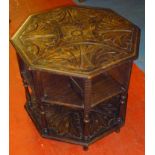 VICTORIAN UNUSUAL OCTAGONAL OAK BOOK TABLE WITH CARVED FLORAL DECORATION, SHELVES AND UNDERTIER ON