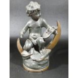 SPELTER FIGURE OF A PUTTI PLAYING A LYRE SITTING ASTRIDE CLOUDS, STARS AND A CRESCENT MOON -