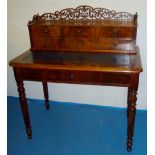 FRENCH MAHOGANY LOUIS PHILIPPE WRITING TABLE WITH A PIERCED GALLERY AND THREE DRAWERS ABOVE, LONG