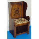 OAK MONK'S SEAT WITH CURVED ARMS, CURVED BACK AND HINGED SEAT (107 cm x 55.5 cm x 46 cm)