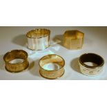 FOUR SILVER NAPKIN RINGS (59.9g) AND A NAPKIN RING BY TEFLER (5)