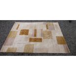 A CHINESE KADIAN CONTEMPORARY RUG, THE BEIGE FIELD WITH RECTANGLES AND PALING DECORATION (240 cm x