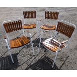 FOUR WHITE PAINTED METAL FRAMED GARDEN CHAIRS WITH TEAK SLATED SEATS AND BRACKETS