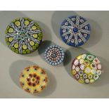 FIVE GLASS MILLEFIORE PAPERWEIGHTS INCLUDING THREE PERTHSHIRE WEIGHTS (LARGEST DIA: 8.5 cm)