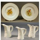 PAIR OF ROYAL WORCESTER PLATES BY WILLIAM POWELL, EACH PAINTED WITH A BIRD PERCHED ON A BRANCH,