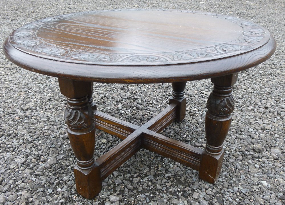 BEECH CIRCULAR COFFEE TABLE WITH INCISED ARCH AND FOLIATE DESIGN TO TOP, ON FOUR ORNATE TURNED - Image 6 of 6