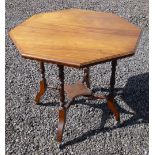 EDWARDIAN MAHOGANY OCTAGONAL TABLE WITH UNDERTIER ON FOUR PARTIALLY TURNED LEGS ON CASTERS (72 cm