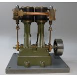 SCRATCH BUILT STEEL AND BRASS MODEL OF A STUART VERTICLE TWIN CYLINDER LAUNCH STEAM ENGINE ON A