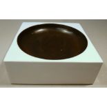 TROIKA POTTERY WHITE SQUARE ASHTRAY DECORATED BY ANN LEWIS WITH GLAZED CIRCULAR MOTIF, THE BASE WITH