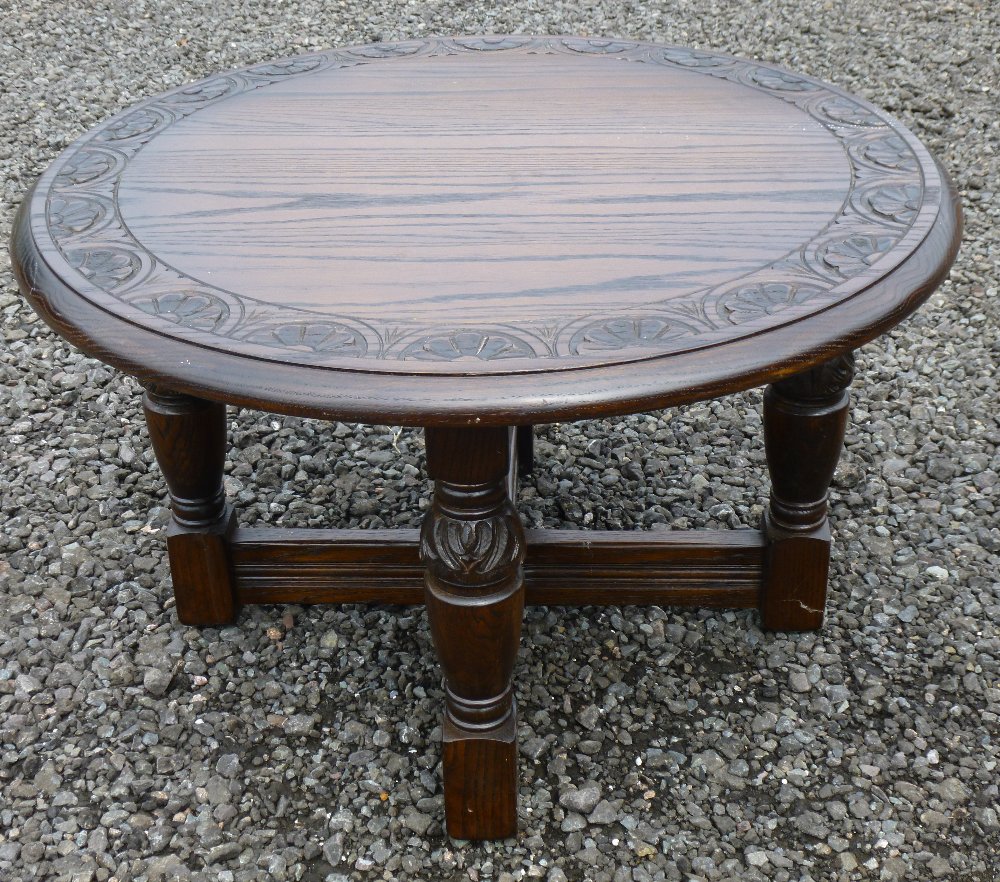 BEECH CIRCULAR COFFEE TABLE WITH INCISED ARCH AND FOLIATE DESIGN TO TOP, ON FOUR ORNATE TURNED - Image 2 of 6