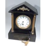 SLATE MANTLE CLOCK WITH PEDIMENT TOP ON TWO BRASS COLUMNS WITH FLORAL MOTIFS, FRENCH MOVEMENT BY R&C