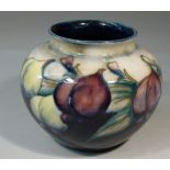 MOORCROFT SMALL OVOID VASE DECORATED IN THE PLUM AND WISTERIA PATTERN, SIGNED WITH IMPRESSED MARK 'W