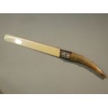 LATE VICTORIAN SILVER MOUNTED IVORY PAPER TURNER WITH CHASED FOLIATE DECORATION AND HORN HANDLE BY