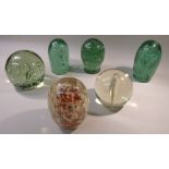 THREE VICTORIAN GREEN GLASS DUMPS OF OVOID FORM WITH BUBBLES/INCLUSIONS (TALLEST 14 cm), A VICTORIAN