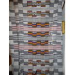 C20th WEST AFRICAN TRIBAL LARGE RUG OR COVERING MADE FROM SIMILAR PIECES OF MATERIAL STITCHED
