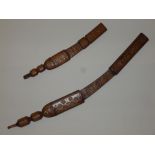 TWO WEST AFRICAN KNIVES BOTH WITH LEATHER HANDLE AND SCABBARD, ENGRAVED DESIGN TO BLADES AND
