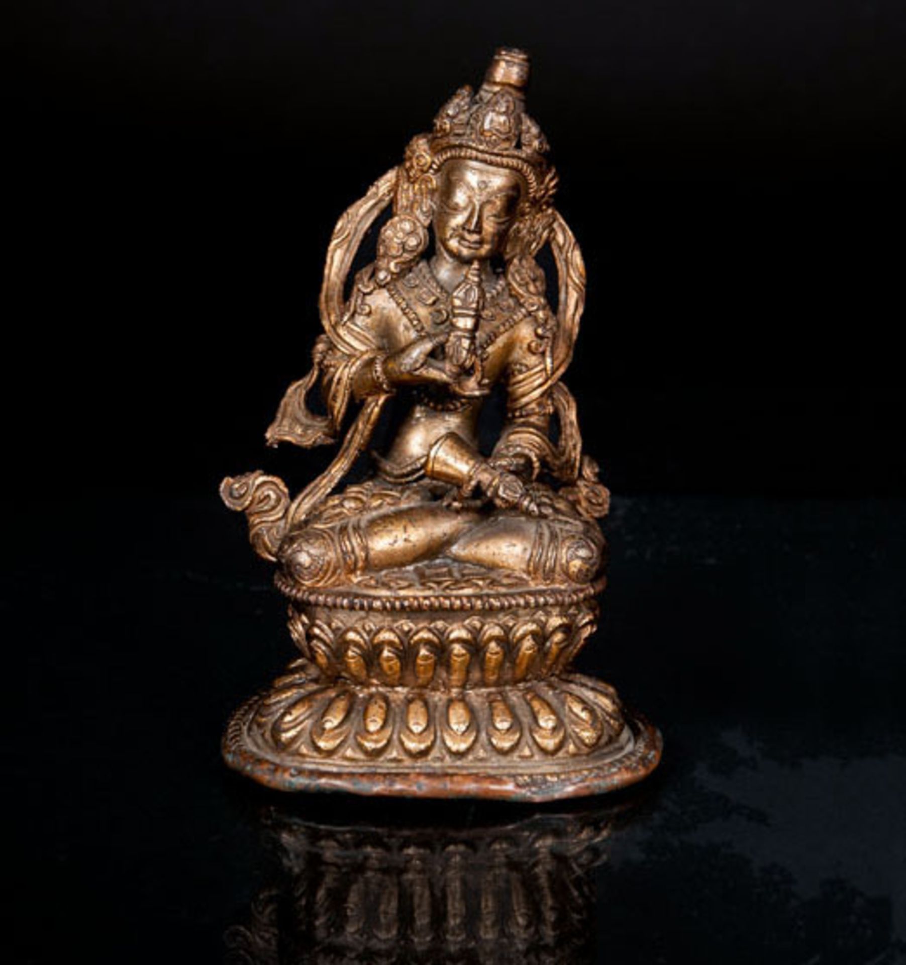 A small bronze 'Vajrasattva' Tibet, 19th cent. Brown patinated bronze. Bodhisattva figure in rich