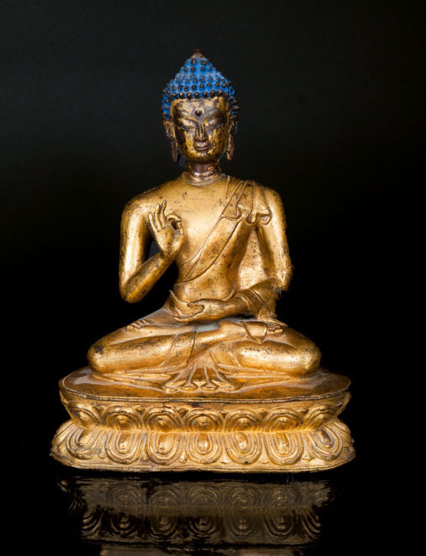 A bronze buddha 'Shakyamuni' Tibet, around 1900. Gilt and partly brown patinated bronze with