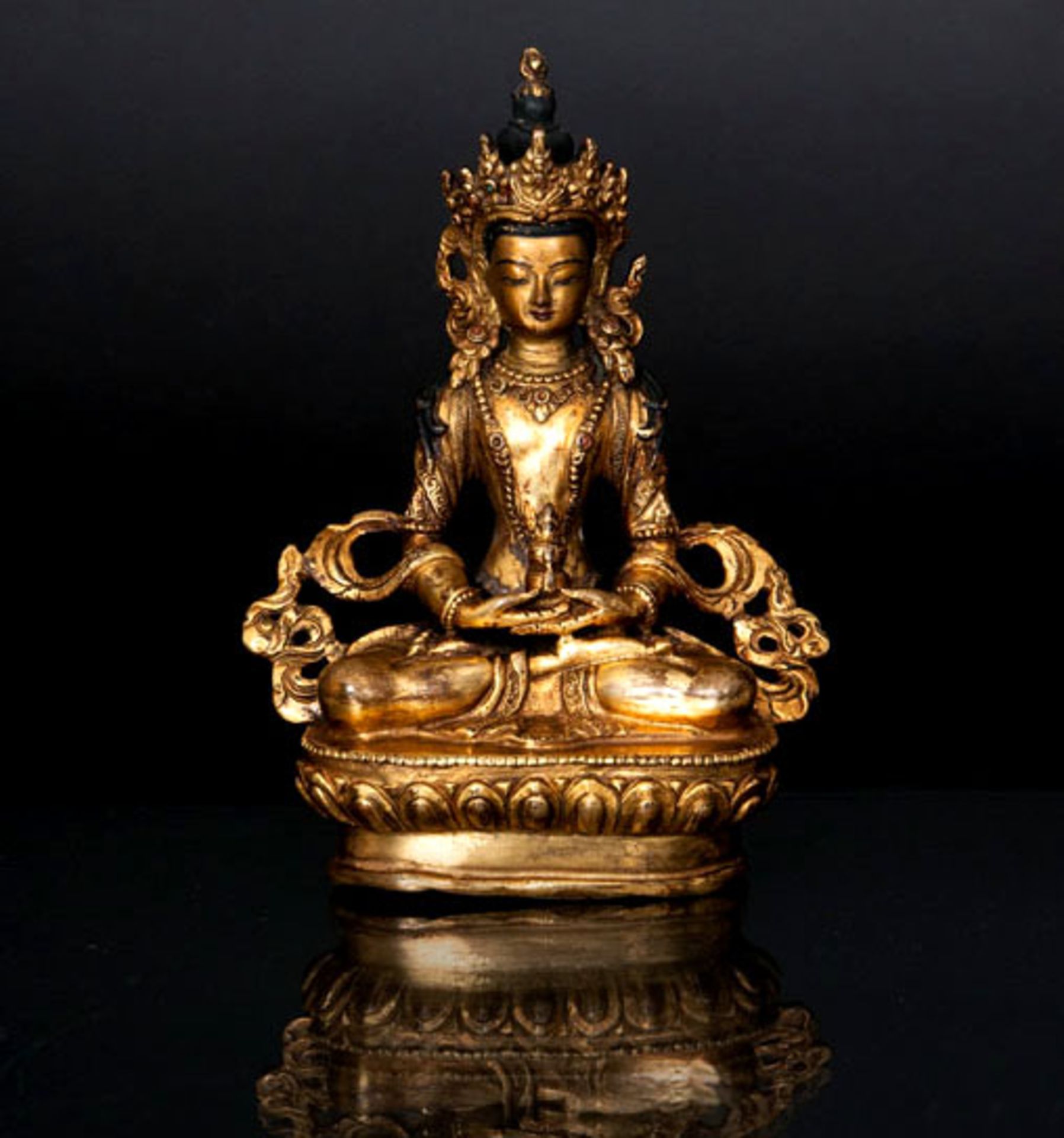 A fine bronze figure of Amitayus Tibet, 19th cent. Gilt bronze partly inlaid with semi-precious