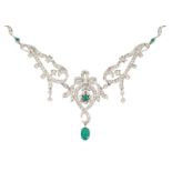 A fine diamond emerald necklace Silver, marked 800. Front side with bows, volute and tendrils,