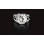 A highcarat solitaire diamond ring 18 ct. white gold, marked. The center diam. in prongsetting in