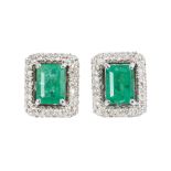 A pair of emerald diamond earstuds 18 ct. white gold, marked. Two emeralds in emerald cut in total