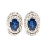 A pair of sapphire diamond earrings 18 ct. white gold, marked. Setting with two sapphires in oval